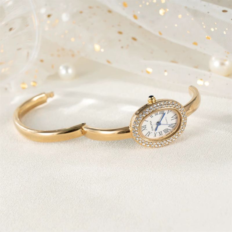 Montre Femme Ovale Dorée Strass Cadran Chiffres Romains Quartz